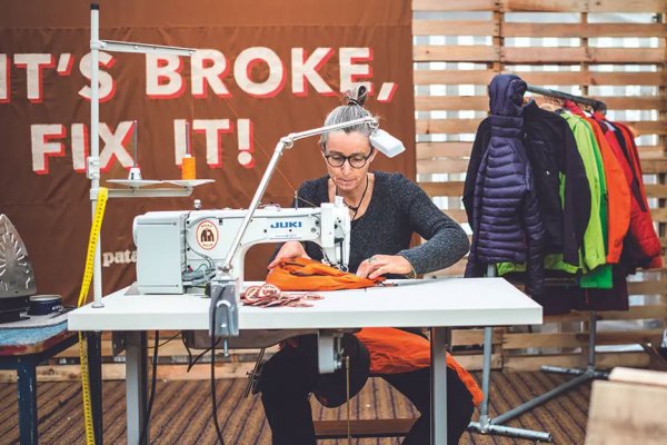 Thumbnail image of a woman at a sewing machine repairs a bag. Text in the background says "it's broke. Fix it." next to a rack of garments.